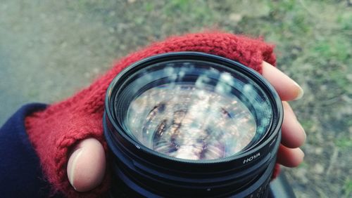 Close-up of cropped hand camera