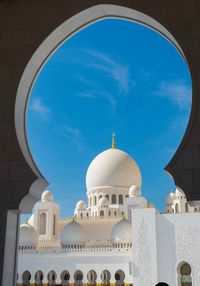 Low angle view of church against blue sky