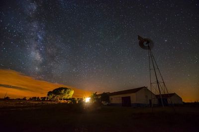 Buildings against sky at night