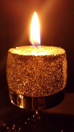 Close-up of illuminated candle