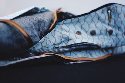 Close-up of jeans on table