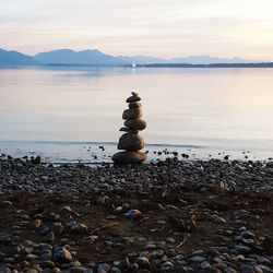 Scenic view of sea with mountain in background