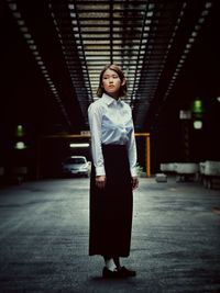 Portrait of woman standing at night