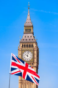 Low angle view of clock tower against sky