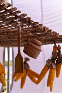 Close-up of clothes hanging in basket