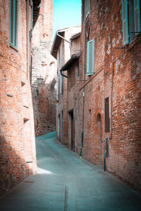 Alley amidst buildings in city