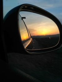 Reflection of sky on side-view mirror