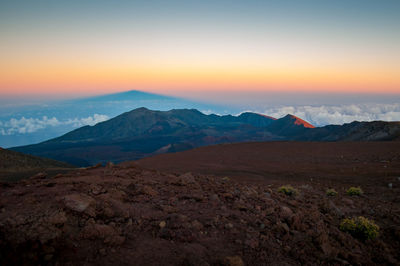 Scenic view of mountains against sky during sunset