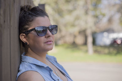 Close-up of young woman in sunglasses