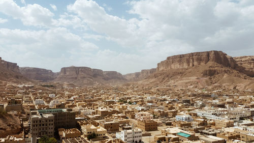 Aerial view of townscape against sky