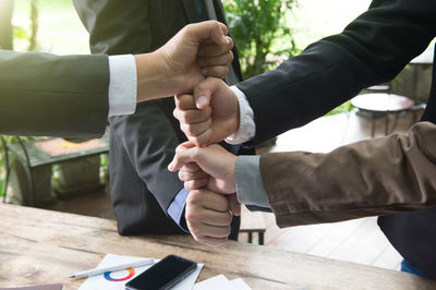 Close-up of hands working on table