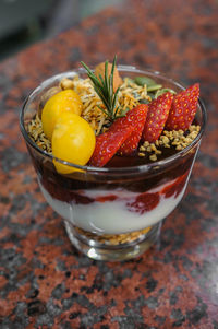 Close-up of granola with greek yogurt, oat granola in tall glass jar. healthy breakfast concept.