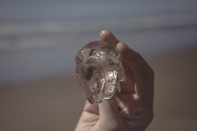 Close-up of hand holding water