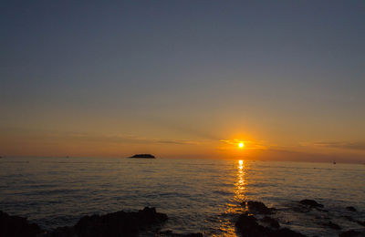 Scenic view of sea against sky during sunset