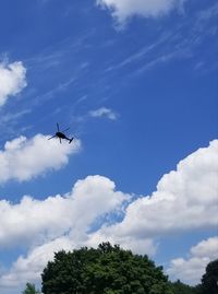 Low angle view of airplane flying in sky