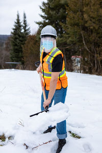 Full length of man on snow covered field