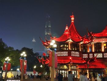 Illuminated buildings in city at night