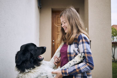 Rear view of woman with dog