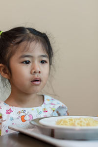 Portrait of cute girl looking away