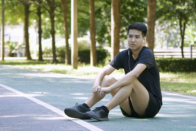 Portrait of a young man sitting outdoors