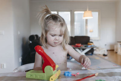 Girl playing play dough