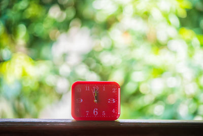 Close-up of clock on table