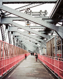 People walking on footbridge