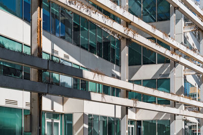 Low angle view of modern glass building in city