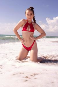 Portrait of woman on beach in bikini 