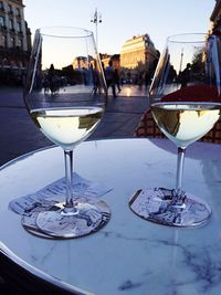 Close-up of wineglass at sidewalk restaurant