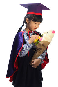 Smiling girl holding umbrella against white background