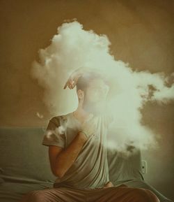 Man sitting on table at home