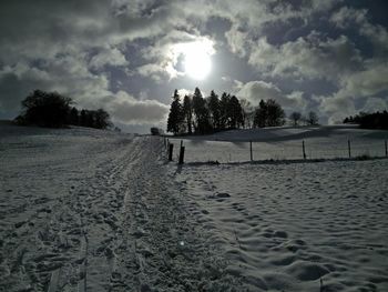 Scenic view of landscape against cloudy sky