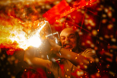 Young man holding firework