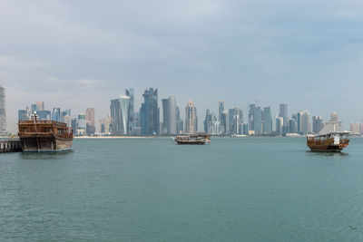 Scenic view of sea and buildings against sky