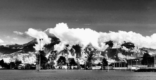 Scenic view of landscape against cloudy sky