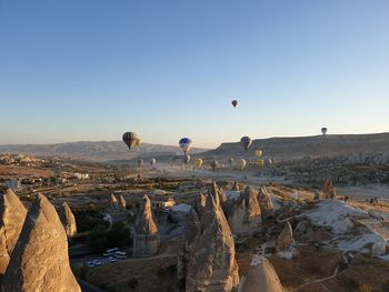 View of hot air balloon flying over rocks