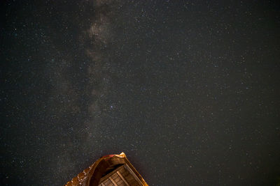 Low angle view of building against sky at night