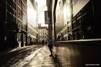 Man walking on street in city