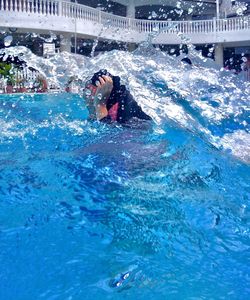 Man swimming in pool