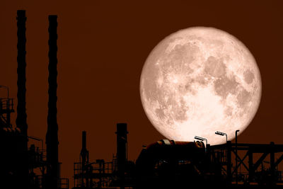 Low angle view of silhouette moon against sky at night