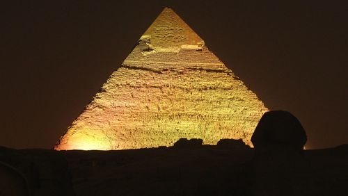 Silhouette of rock formations at night