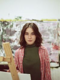 Portrait of young woman standing outdoors