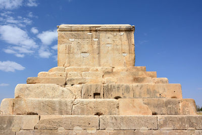 Low angle view of historical building against blue sky