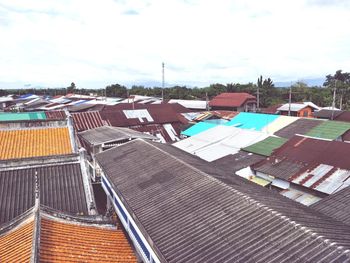 High angle view of houses against sky in city