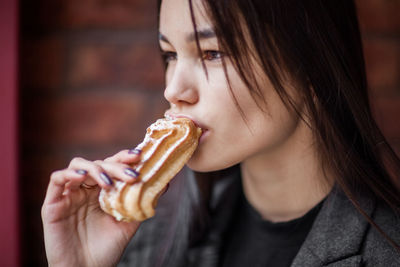 Close-up of woman eating food