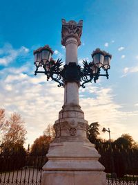 Low angle view of street light against sky