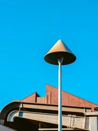 Low angle view of street light against clear blue sky