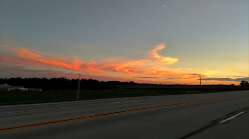 Road against dramatic sky during sunset
