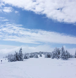 Scenic view of snow covered landscape against sky